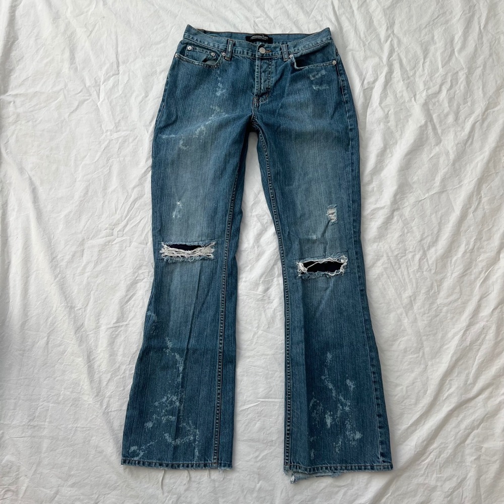 vintage mid rise ripped bootcut jeans